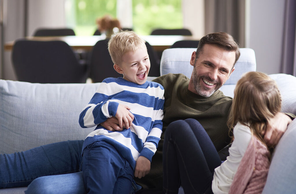 Happy dad and his children spending time together